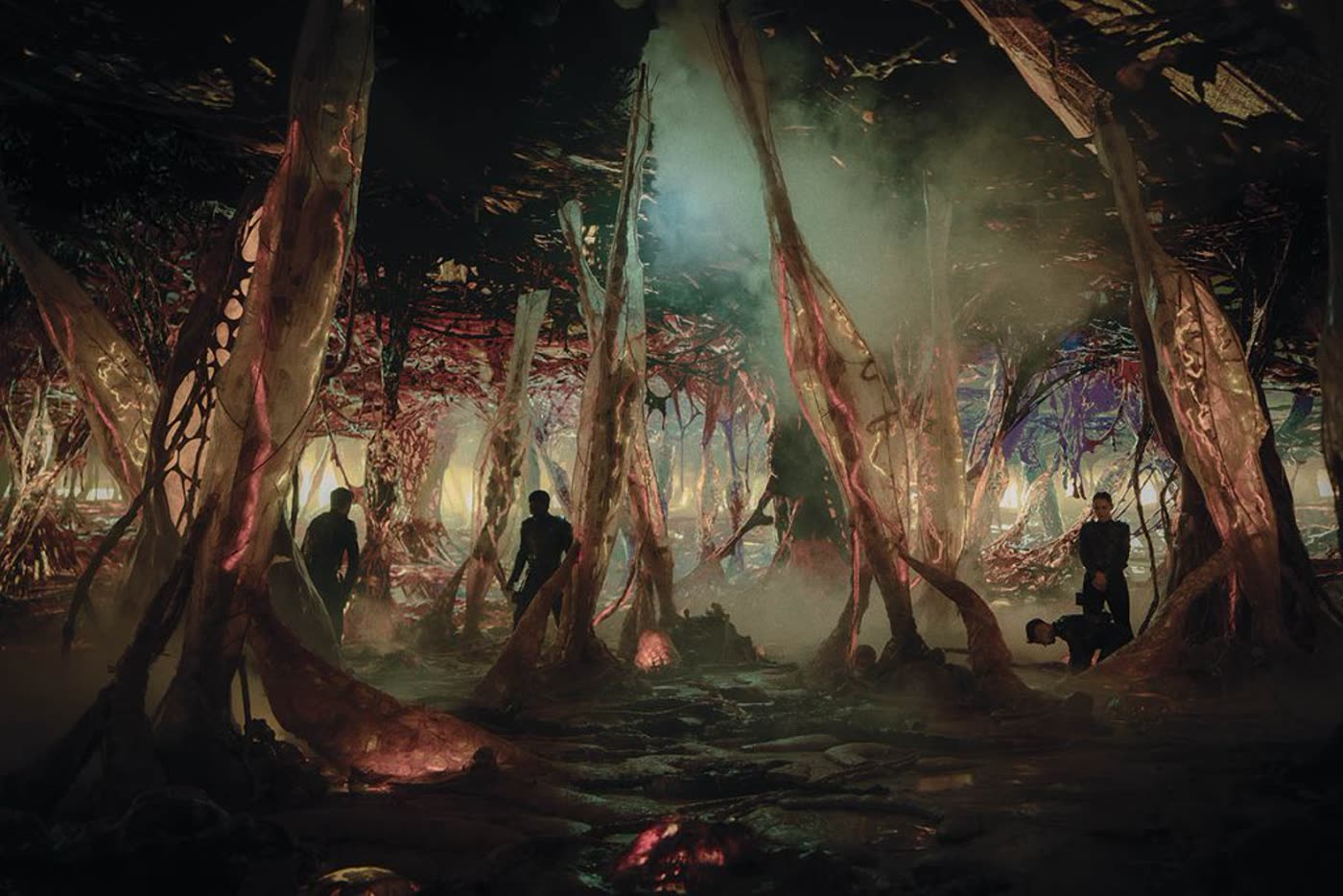 Landing party in a bioluminescent Gorn hive environment from Star Trek: Strange New Worlds season three.